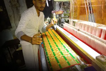 A weaver at a Banarasi sari loom in Varanasi